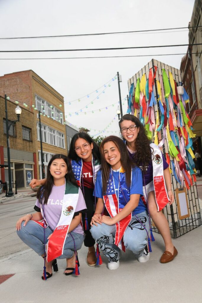 Four Female Latino Students Outside Posing ATLAST Nonprofit McKinney Texas.