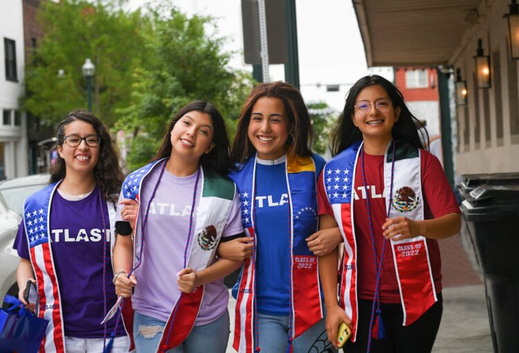 Four Female Latino Students Outside Walking ATLAST Nonprofit McKinney Texas.