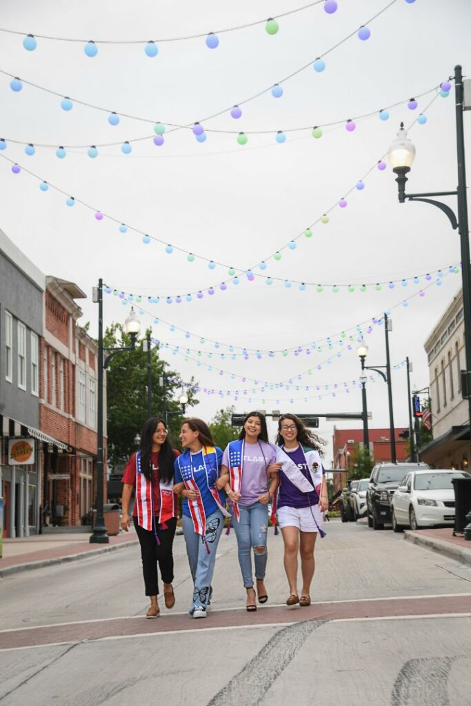 Four Female Latino Students Outside Walking Downtown ATLAST Nonprofit McKinney Texas.